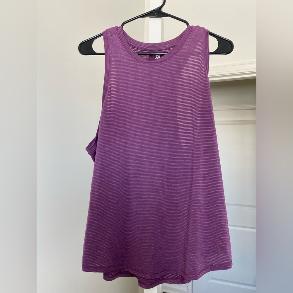 Worn a few times - purple work out tank. Size Large. Brand is “all in motion”